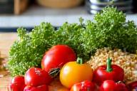 Fresh, healthy ingredients on a cutting board, symbolizing nutritional planning.